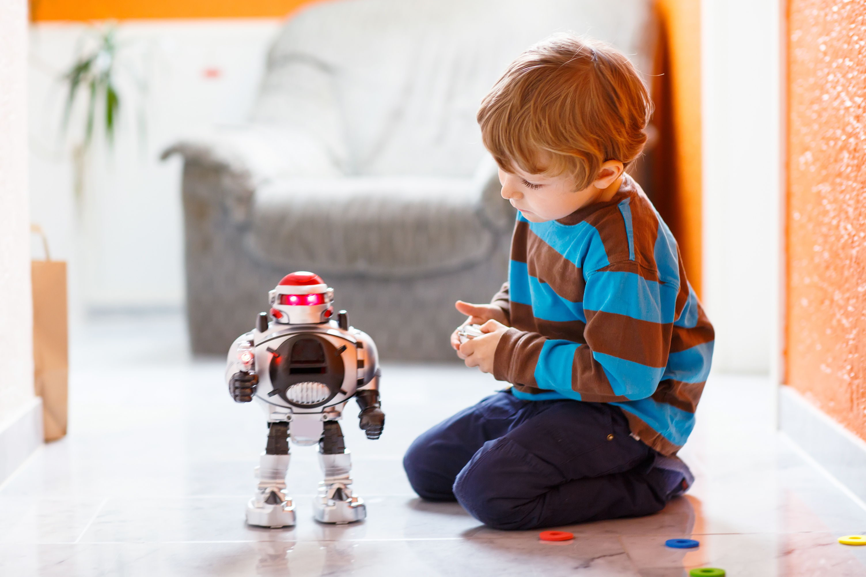 What Is Coding for Kids - Little boy plays with robot