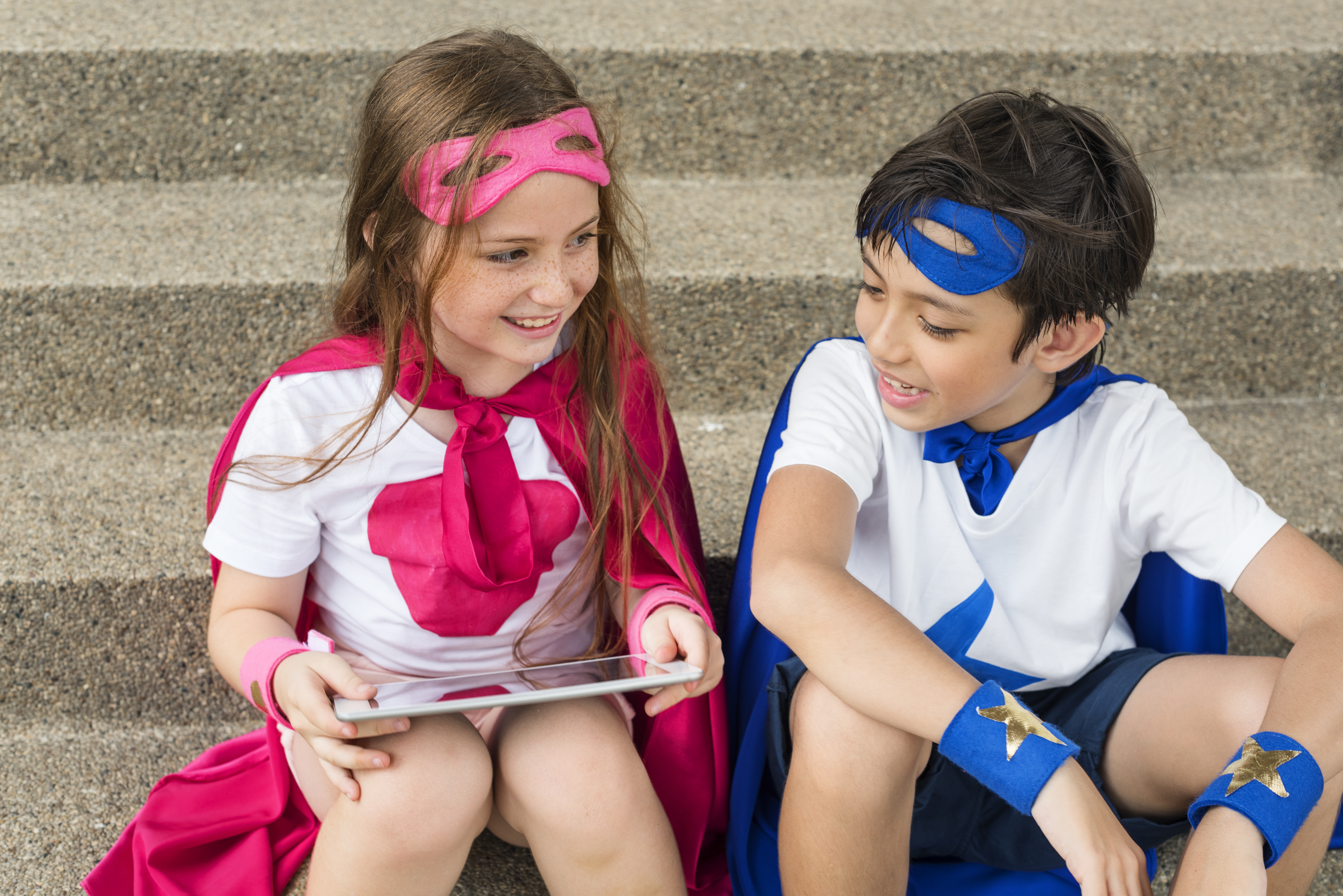 What Is Coding for Kids - Girl and boy dressed as superheroes