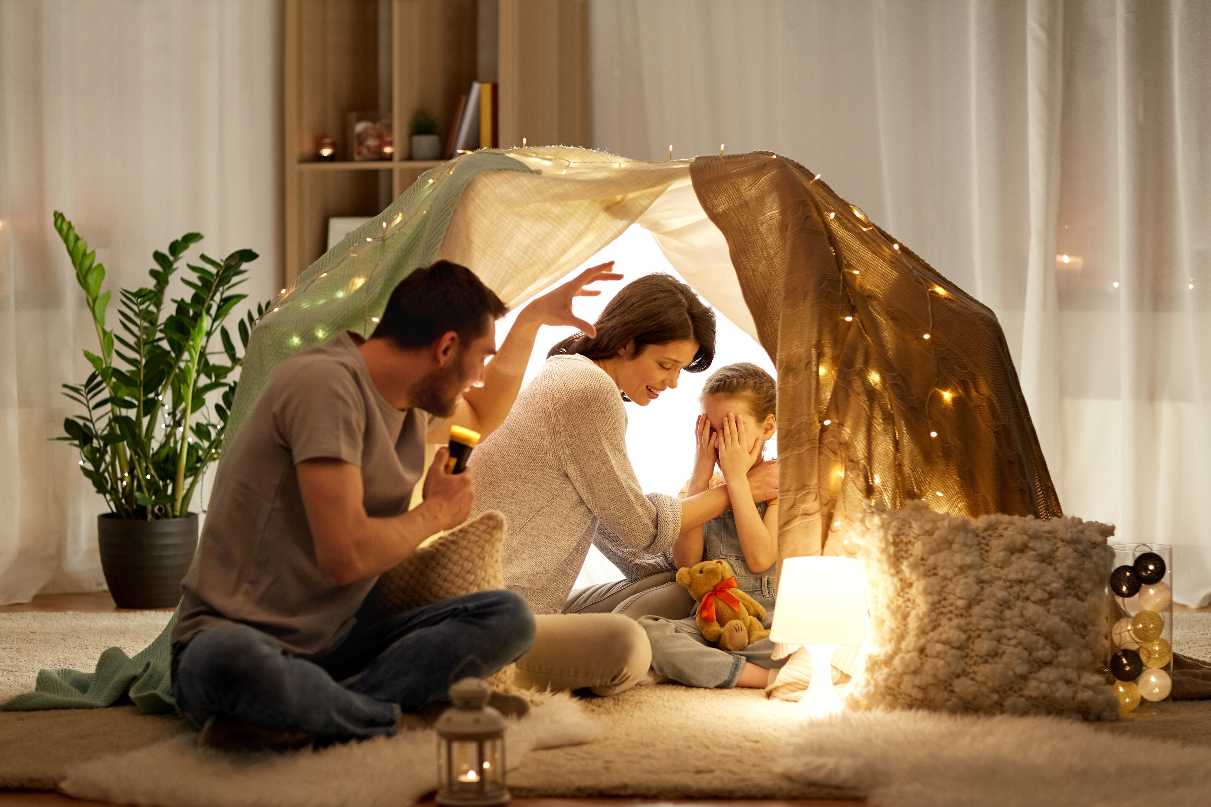 Family playing in indoor tent