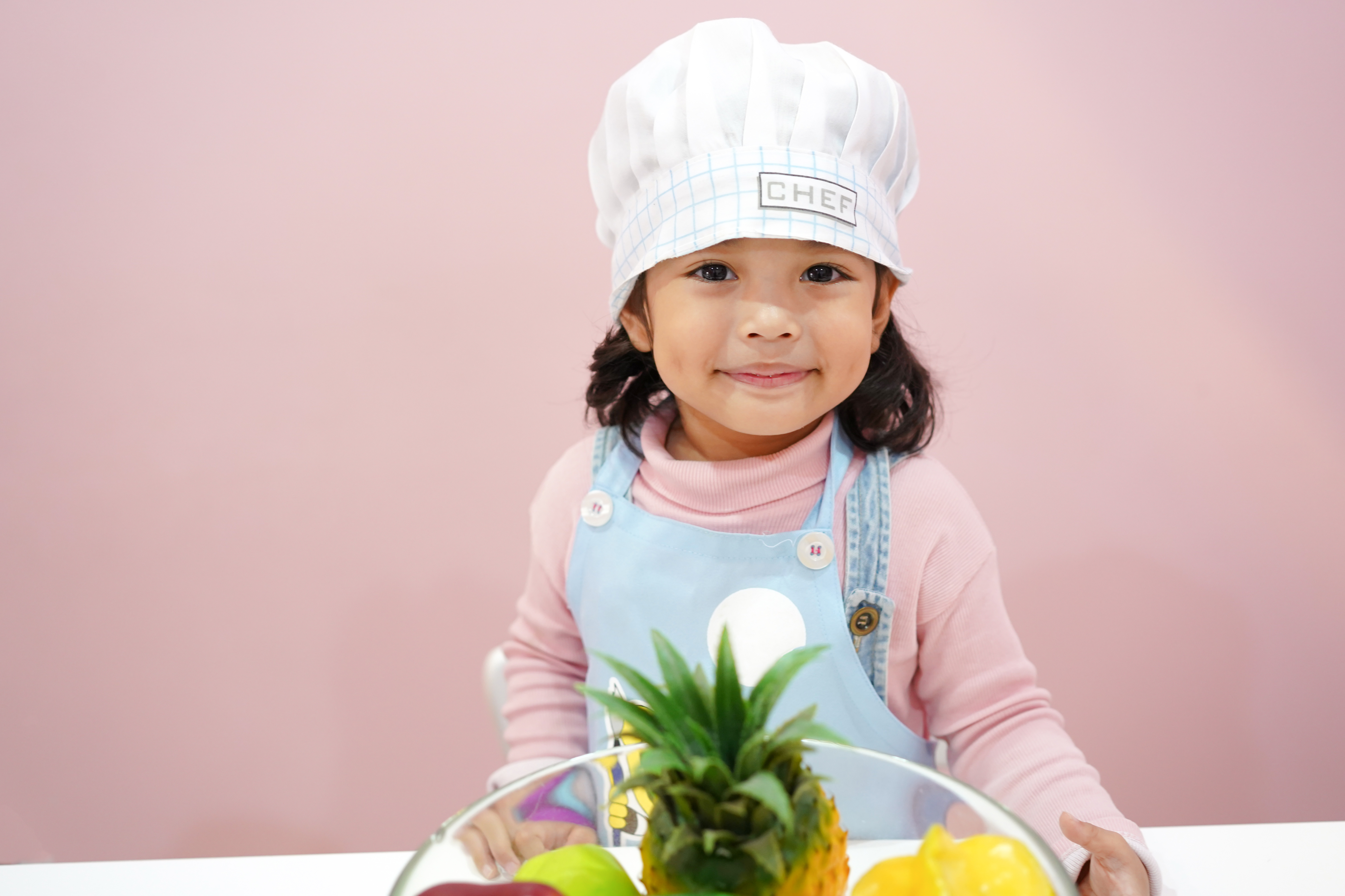 What is coding for kids - girl in chef hat
