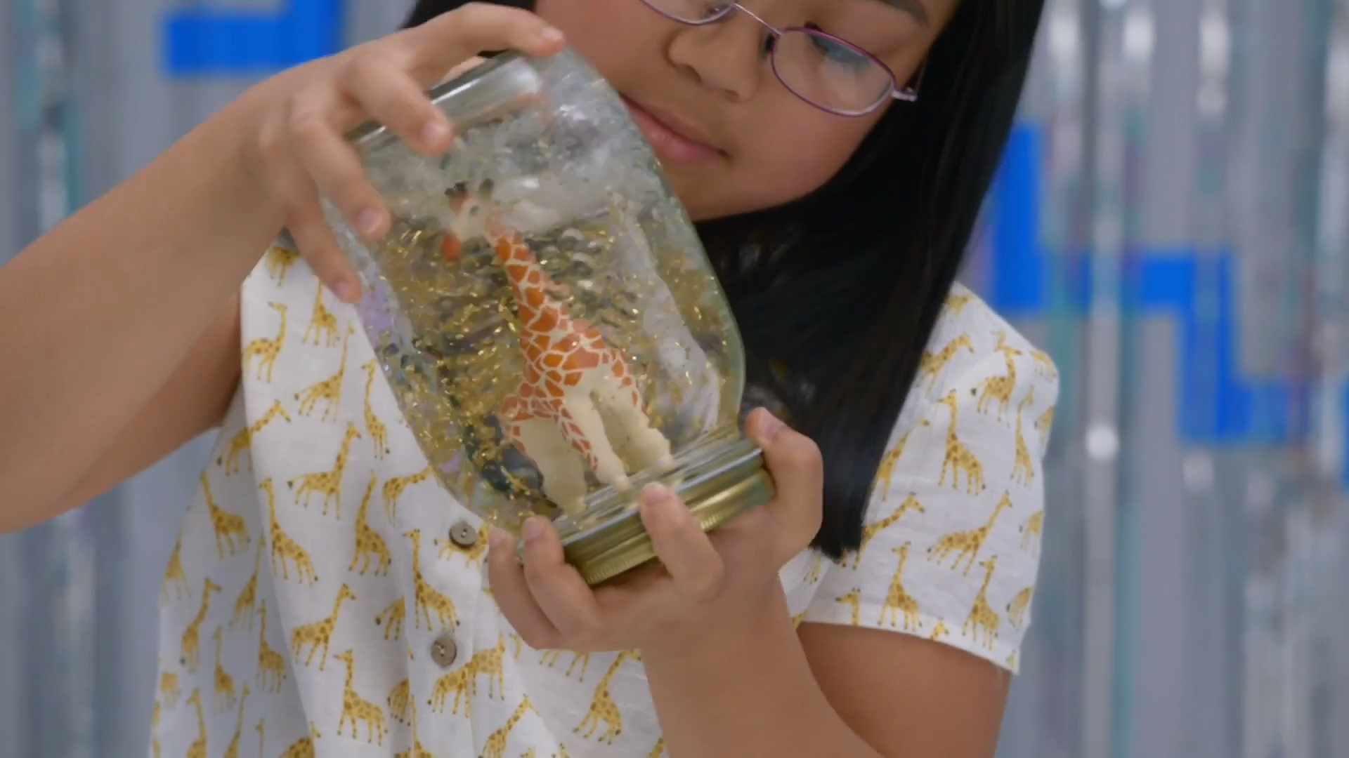 Photo of Girl Holding Snow Globe