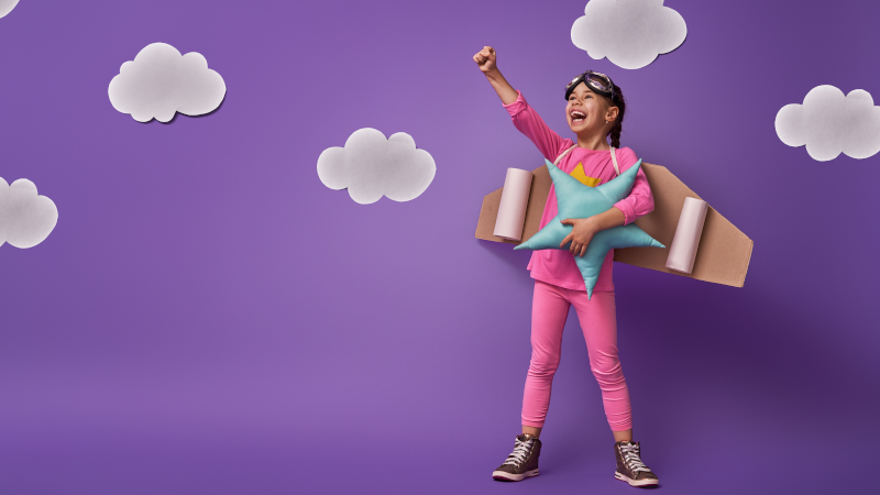Imaginative Play - girl dresses ad superhero