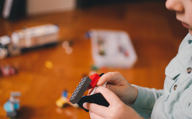 Problem solving kids - child plays with lego